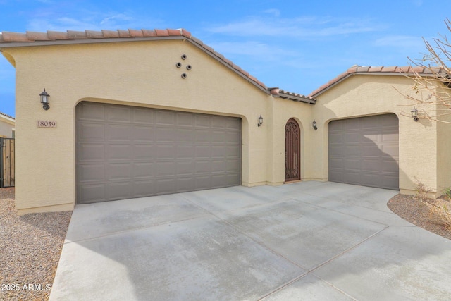 mediterranean / spanish-style house featuring a garage