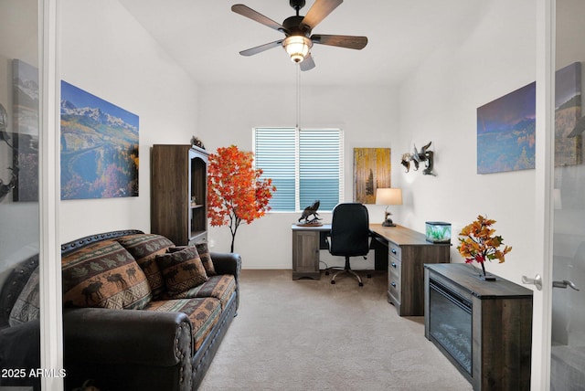 office featuring light carpet and ceiling fan