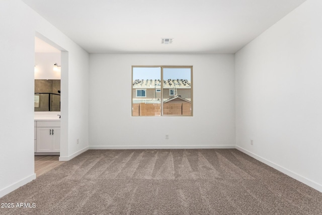 40546 W Michaels Dr, Maricopa, AZ 85138 - empty room featuring light carpet and baseboards