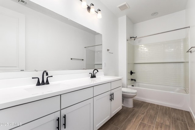 40546 W Michaels Dr, Maricopa, AZ 85138 - full bath with toilet, double vanity, shower / bathtub combination, and wood finished floors