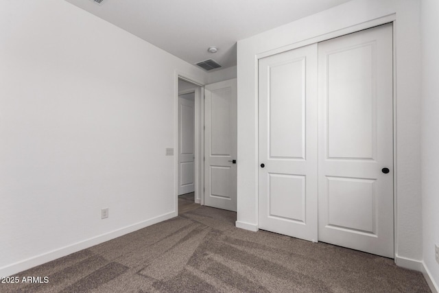 40546 W Michaels Dr, Maricopa, AZ 85138 - unfurnished bedroom featuring carpet, a closet, and baseboards