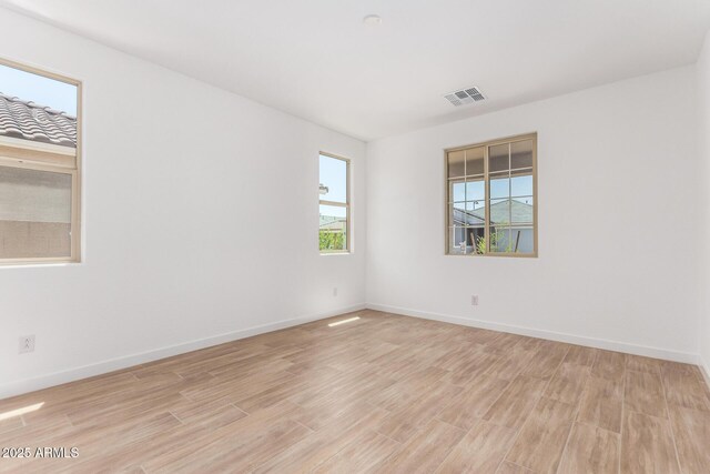 40546 W Michaels Dr, Maricopa, AZ 85138 - spare room with light wood finished floors and baseboards