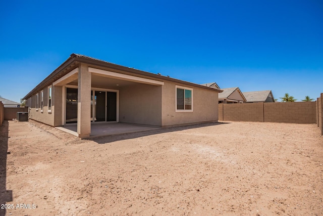 40546 W Michaels Dr, Maricopa, AZ 85138 - back of house featuring a patio area, central AC, a fenced backyard, and stucco siding