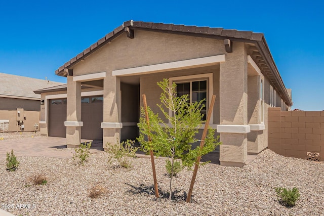 40546 W Michaels Dr, Maricopa, AZ 85138 - view of front of property featuring a garage, stucco siding, and driveway