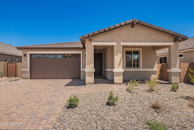 40546 W Michaels Dr, Maricopa, AZ 85138 - view of front of property featuring a garage, decorative driveway, stucco siding, and a tile roof