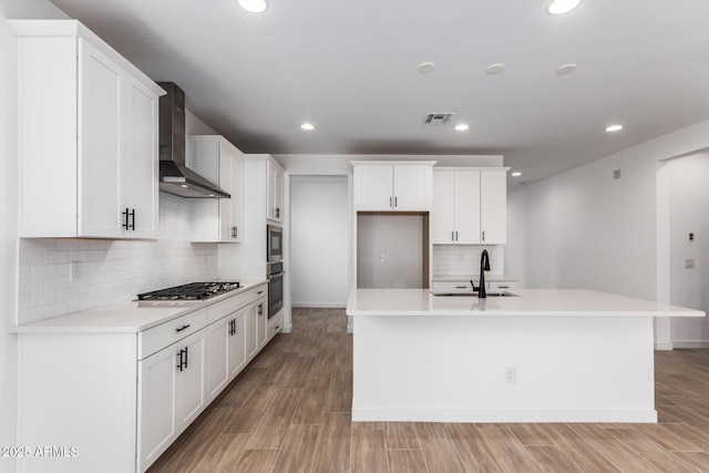 40546 W Michaels Dr, Maricopa, AZ 85138 - kitchen featuring wall chimney exhaust hood, appliances with stainless steel finishes, decorative backsplash, a sink, and recessed lighting