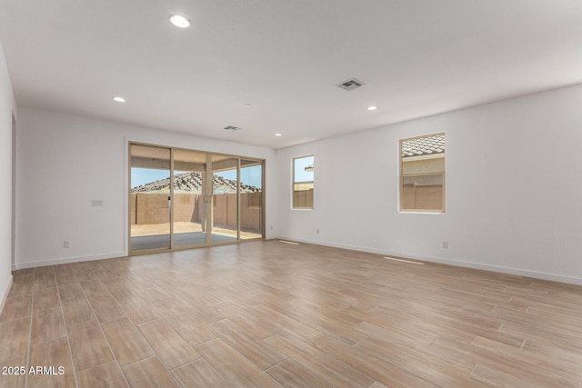 40546 W Michaels Dr, Maricopa, AZ 85138 - spare room featuring baseboards, light wood-style floors, and recessed lighting