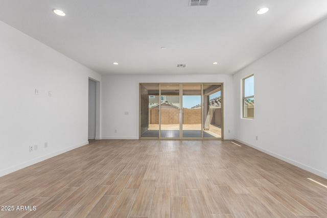 40546 W Michaels Dr, Maricopa, AZ 85138 - empty room featuring light wood-style flooring, baseboards, and recessed lighting