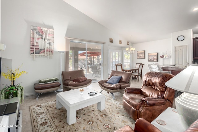 living room featuring a notable chandelier and lofted ceiling