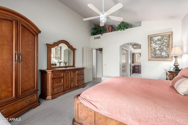 bedroom featuring ceiling fan, light carpet, and lofted ceiling