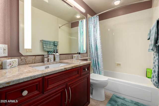 full bathroom featuring tile patterned floors, vanity, toilet, and shower / bath combo with shower curtain