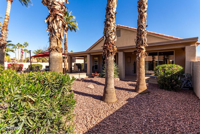 back of property with a patio area