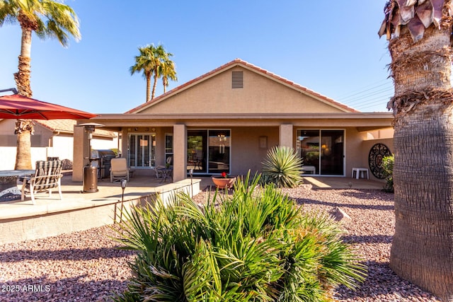 rear view of house with a patio