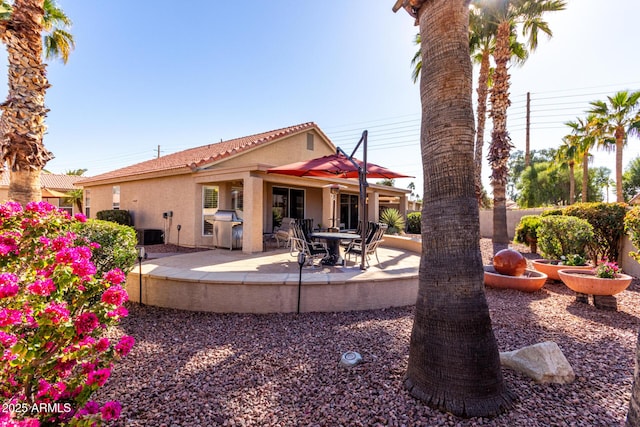 rear view of house featuring a patio area