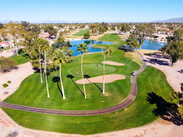 aerial view featuring a water view and golf course view