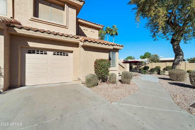 view of property exterior featuring a garage