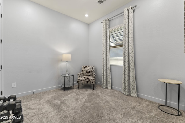 living area with carpet floors and baseboards