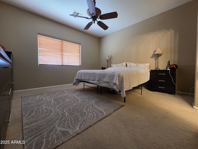 6565 E Thomas Rd Unit 1128, Scottsdale, AZ 85251 - bedroom featuring light carpet, baseboards, and ceiling fan