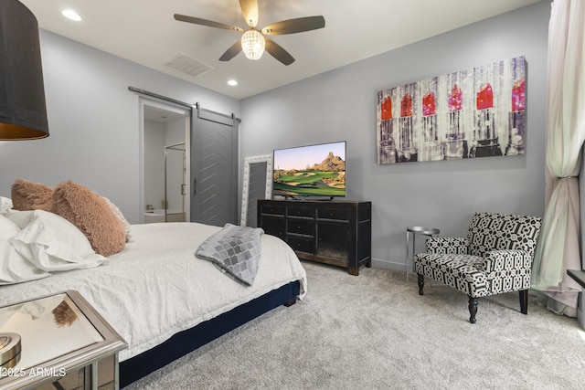 carpeted bedroom featuring recessed lighting, visible vents, ceiling fan, and a barn door