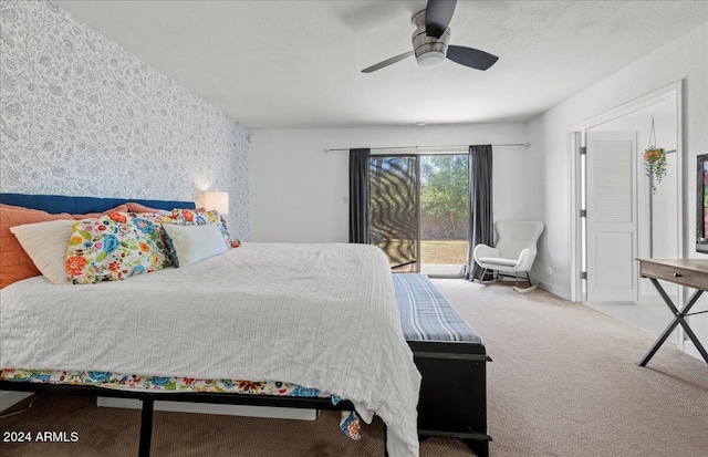 carpeted bedroom featuring ceiling fan and access to outside