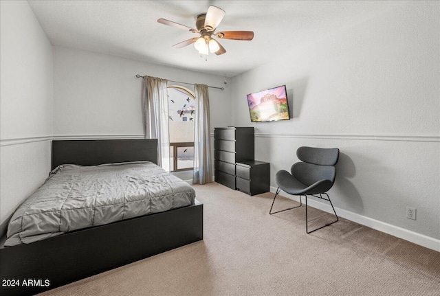 bedroom with ceiling fan and light colored carpet