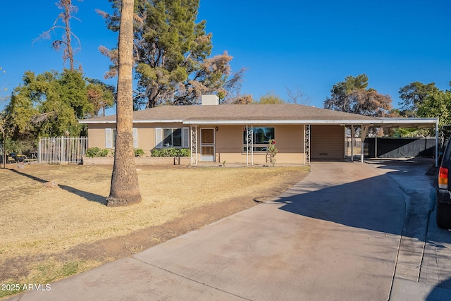 view of front of home with a carport