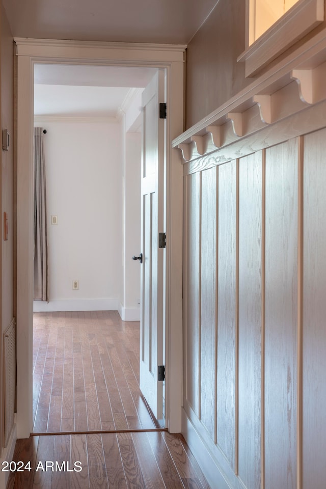 mudroom with wood-type flooring