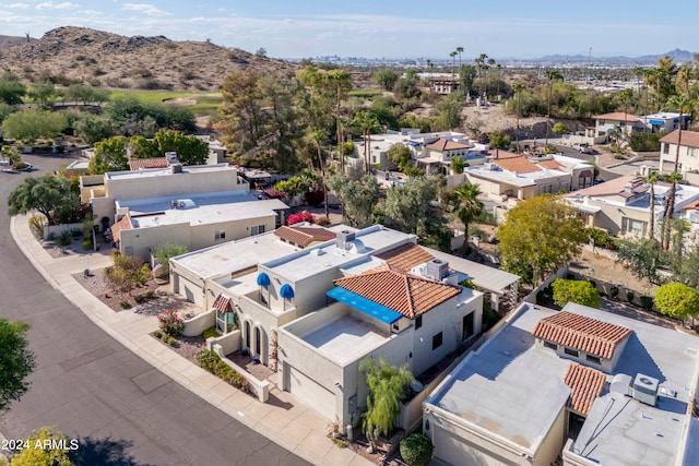 birds eye view of property featuring a mountain view