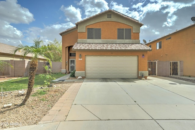 traditional home with a tiled roof, an attached garage, driveway, and stucco siding