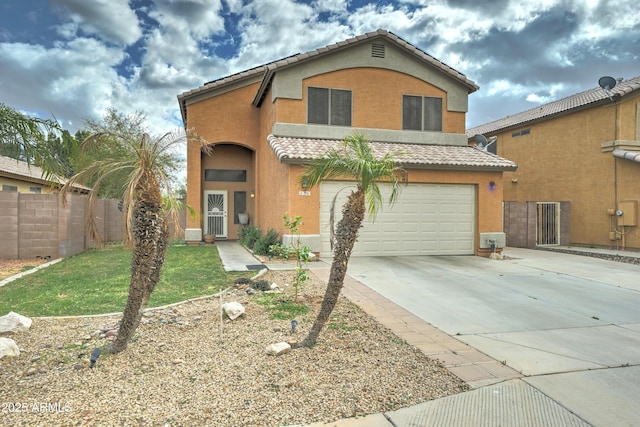 traditional-style house featuring fence, a tiled roof, concrete driveway, stucco siding, and a garage