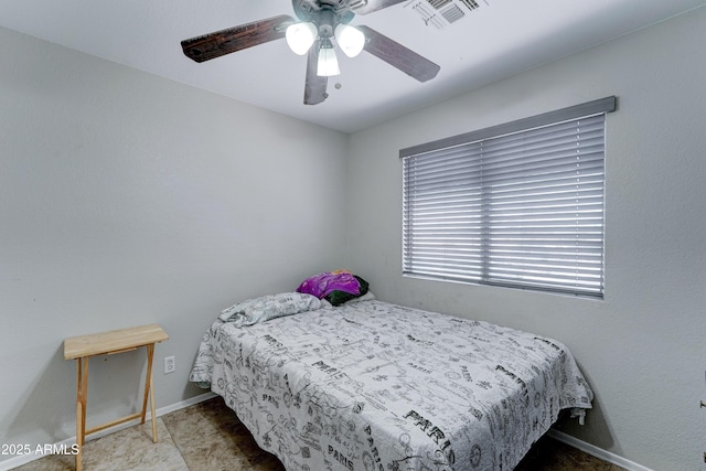 bedroom featuring visible vents, baseboards, and a ceiling fan