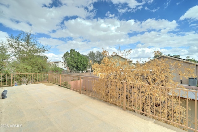 view of patio / terrace featuring central AC unit and fence