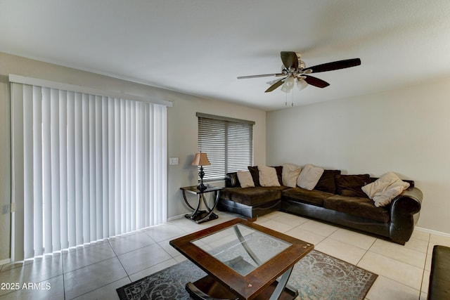 living room with tile patterned floors and a ceiling fan