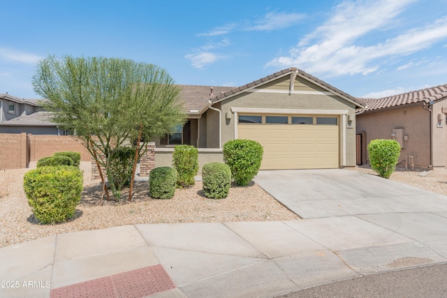 5957 N 89th Dr, Glendale, AZ 85305 - single story home featuring an attached garage, concrete driveway, a tiled roof, and stucco siding
