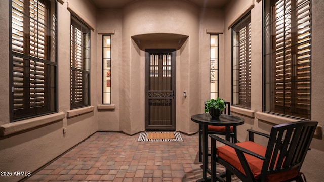 entrance to property featuring a patio