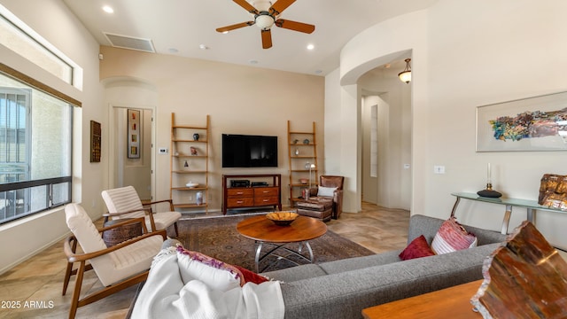 living room with visible vents, arched walkways, ceiling fan, and recessed lighting