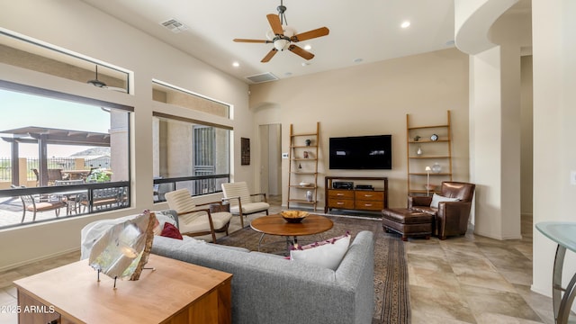 living room featuring baseboards, visible vents, recessed lighting, and a ceiling fan