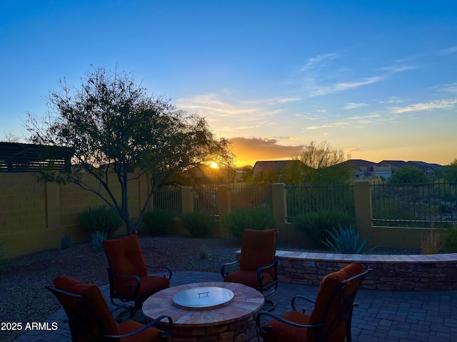 view of patio featuring an outdoor fire pit and fence private yard
