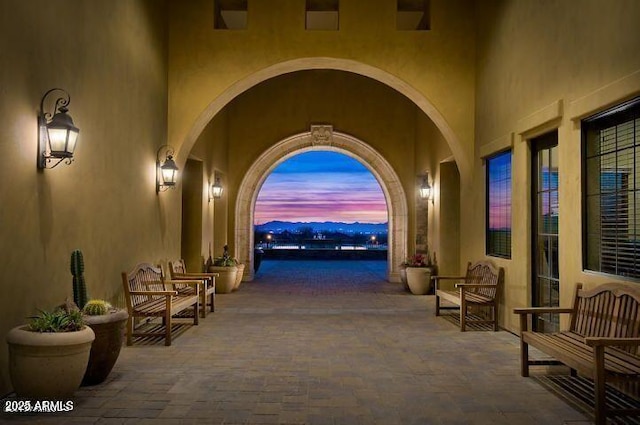 view of patio terrace at dusk