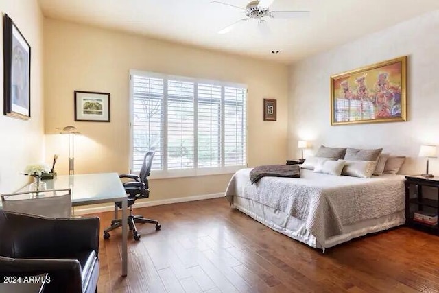 bedroom with hardwood / wood-style floors and ceiling fan