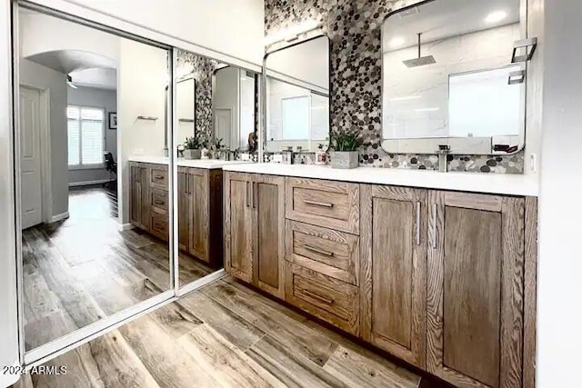 bathroom featuring hardwood / wood-style floors and vanity