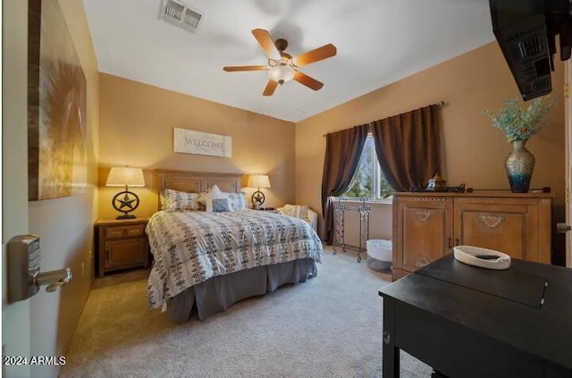 bedroom with light carpet and ceiling fan