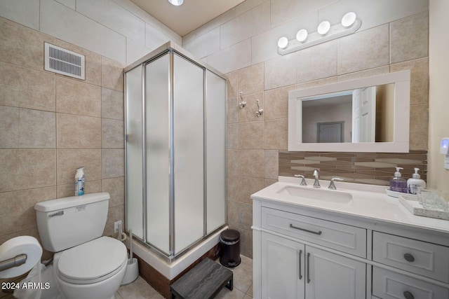 bathroom with walk in shower and tile walls