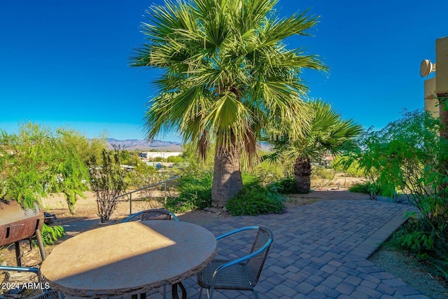 view of patio / terrace featuring a mountain view