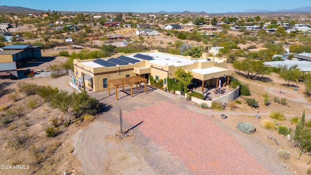 birds eye view of property featuring a mountain view