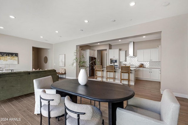 dining room with dark hardwood / wood-style floors