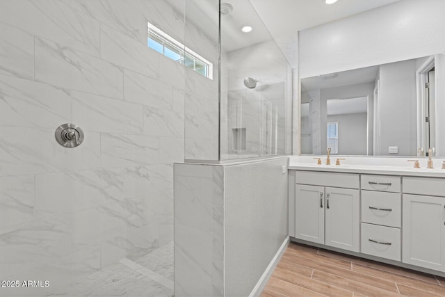 21047 N 58th Way, Phoenix, AZ 85054 - full bath featuring walk in shower, double vanity, wood finished floors, and recessed lighting