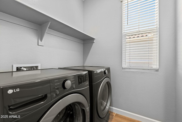 21047 N 58th Way, Phoenix, AZ 85054 - laundry room with separate washer and dryer, baseboards, and wood finished floors