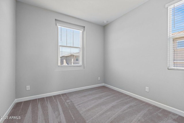 21047 N 58th Way, Phoenix, AZ 85054 - carpeted spare room featuring baseboards