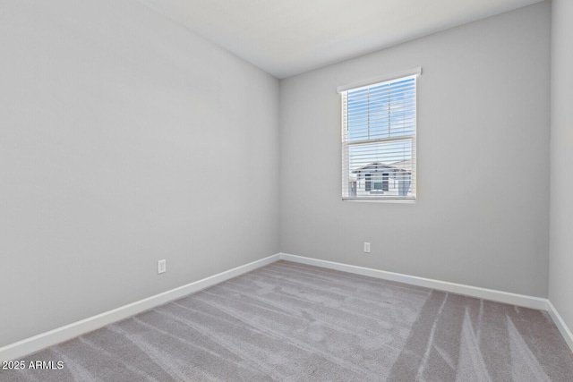 21047 N 58th Way, Phoenix, AZ 85054 - carpeted empty room with baseboards